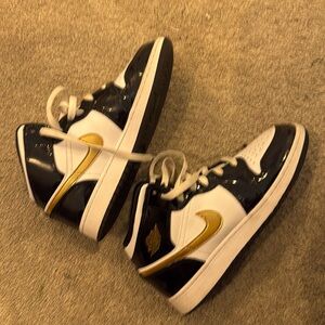 Gold  and Black Jordan’s